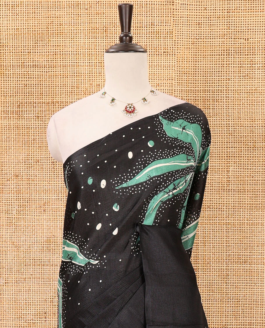 Black-base plain body khadi cotton saree with batik-style green-color floral & dots printed on its border & pallu, plain black blouse - Image 3